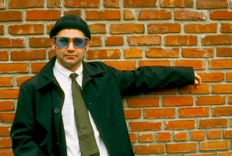 Jonathan wearing hat, tie, cap and Blue Sunglasses, © Margaret Schnipper, photographer