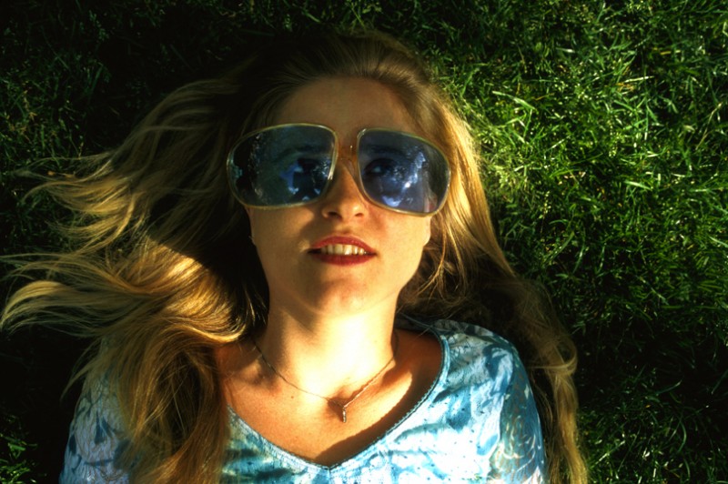 Mary wearing Blue Sunglasses, © Margaret Schnipper, photographer